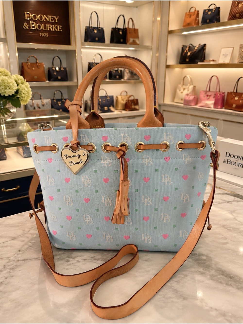Dooney & Bourke Light Blue Canvas Tote with Pink Hearts and Tan Trim